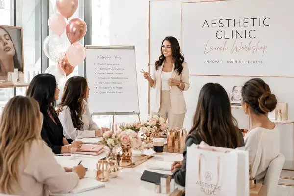 Aesthetic clinic team hosting a hands-on skincare workshop during launch event.